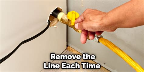 how to remove stuck gas line from stove